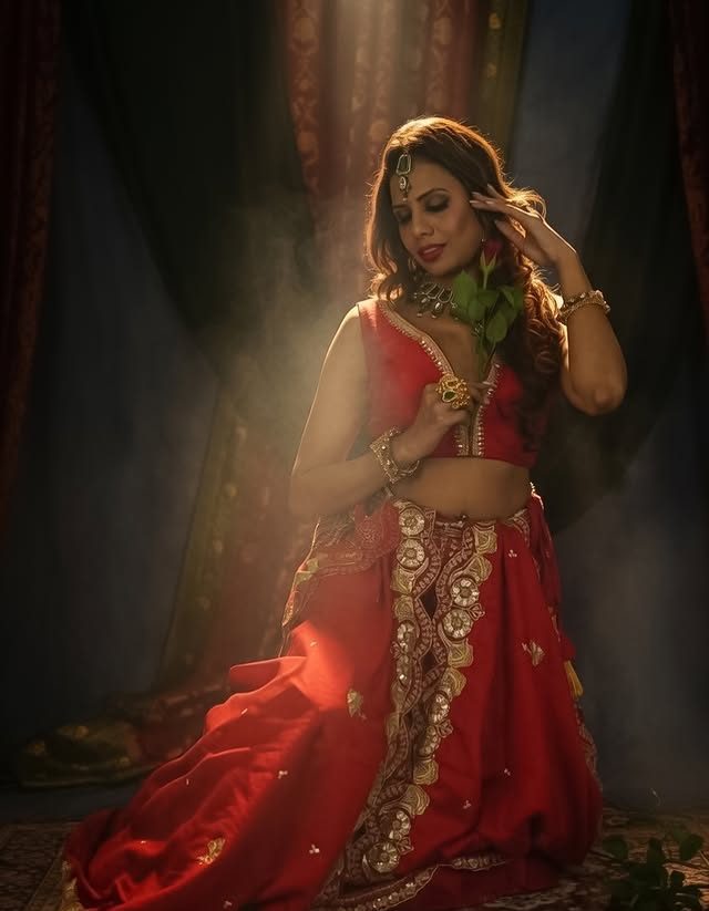 Natasha in a traditional red lehenga, editorial fashion shoot